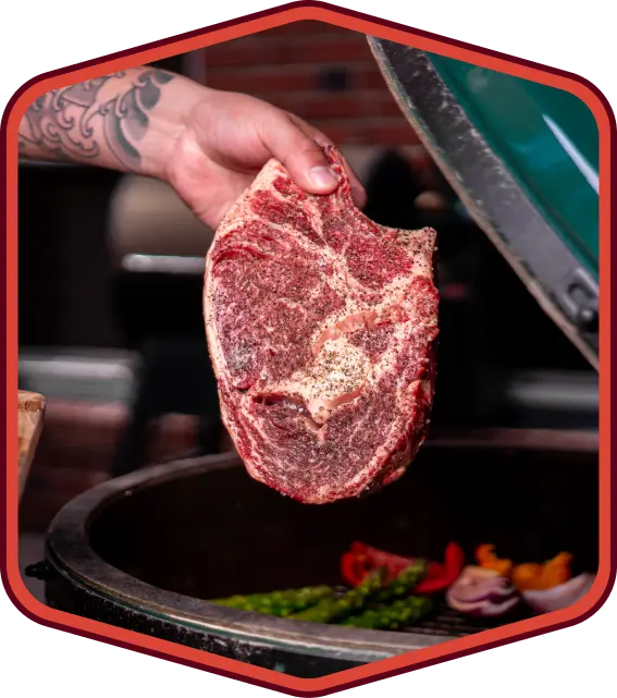 butcher preparing ribeye