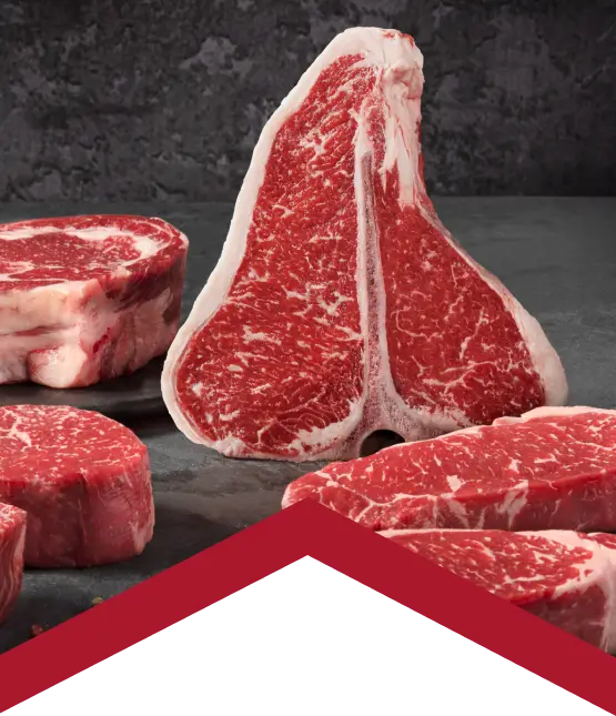 raw beef steaks on cutting board